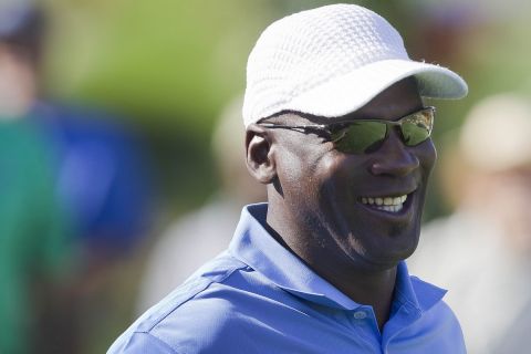 Michael Jordan smiles after teeing off during the Michael Jordan Invitational celebrity golf tournament, Thursday, March 31, 2011, in Las Vegas. (AP Photo/Julie Jacobson)