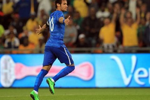 Brazil's Neymar celebrates after scoring a goal during their international friendly soccer match against South Africa at Soccer City Stadium in Johannesburg, South Africa, Wednesday, March 5, 2014. (AP Photo/Themba Hadebe)