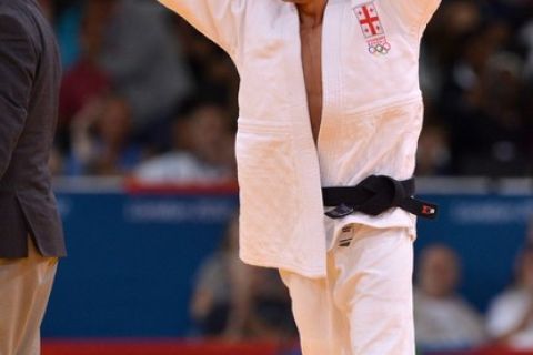 Georgia's Lasha Shavdatuashvili celebrates after winning against Japan's Masashi Ebinuma during their men's -66kg contest semi-final match of the judo event at the London 2012 Olympic Games on July 29, 2012 at the ExCel arena in London.   AFP PHOTO / JOHANNES EISELE        (Photo credit should read JOHANNES EISELE/AFP/GettyImages)