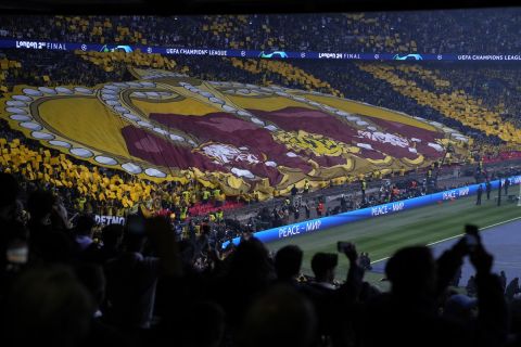 Real Madrid fans cheer during the Champions League final soccer match between Borussia Dortmund and Real Madrid at Wembley stadium in London, Saturday, June 1, 2024. (AP Photo/Alastair Grant)