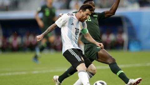 Argentina's Lionel Messi scores the opening goal of his team during the group D match between Argentina and Nigeria, at the 2018 soccer World Cup in the St. Petersburg Stadium in St. Petersburg, Russia, Tuesday, June 26, 2018. (AP Photo/Petr David Josek)