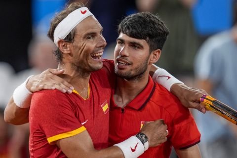 Rafael Nadal, left, and Carlos Alcaraz of Spain react after losing against Austin Krajicek and Rajeev Ram of the USA during the men's doubles quarter-final tennis competition at the Roland Garros stadium, at the 2024 Summer Olympics, Wednesday, July 31, 2024, in Paris, France. (AP Photo/Manu Fernandez)