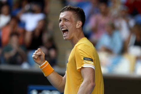 Jiri Lehecka of the Czech Republic celebrates after winning the third set of his fourth round match against Felix Auger-Aliassime of Canada  at the Australian Open tennis championship in Melbourne, Australia, Sunday, Jan. 22, 2023. (AP Photo/Asanka Brendon Ratnayake)