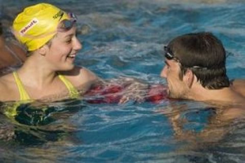 Michael Phelps of the United States, right, talks to Australia's Stephanie Rice during practice, at the FINA Swimming World Championships in Rome, Thursday, July 23, 2009. (AP Photo/Domenico Stinellis)