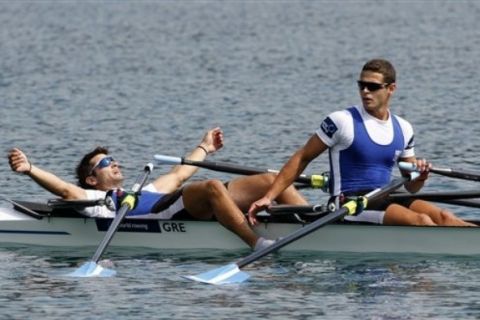 Greece's  Eleftherios Konsolas, left, and Panagiotis Magdanis celebrate at the finish line of Lightweight Men's Double Sculls Quarterfinal event at World Rowing Championships in Bled, Slovenia, Wednesday, Aug. 31, 2011. ( AP Photo/Filip Horvat)