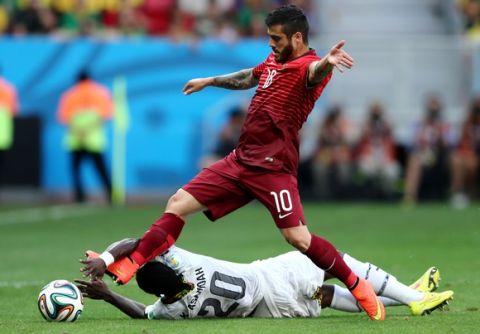 BRASILIA, BRAZIL - JUNE 26:  Vieirinha of Portugal and Kwadwo Asamoah of Ghana compete for the ball during the 2014 FIFA World Cup Brazil Group G match between Portugal and Ghana at Estadio Nacional on June 26, 2014 in Brasilia, Brazil.  (Photo by Warren Little/Getty Images)