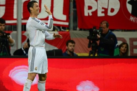 Real Madrid's Portuguese forward Cristiano Ronaldo celebrates scoring the 0-3 during the UEFA Champions League second-leg semi-final football match FC Bayern Munich vs Real Madrid CF in Munich, southern Germany, on April 29, 2014. AFP PHOTO / JOHN MACDOUGALL        (Photo credit should read JOHN MACDOUGALL/AFP/Getty Images)