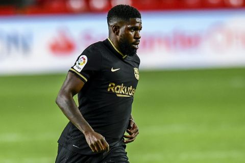 FILE - Barcelona's Samuel Umtiti runs with the ball during the Spanish La Liga soccer match between Granada and FC Barcelona at the Los Carmenes stadium in Granada, Spain, Jan. 9, 2021. World Cup-winning France defender Umtiti will prepare for this years tournament in Italy instead of Barcelona after moving on loan to Lecce, it was announced Thursday, Aug. 25, 2022. Barcelona says the newly promoted Serie A club has taken Umtiti for one season with no option to buy. (AP Photo/Jose Breton, file)