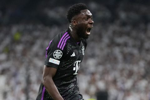 Bayern's Alphonso Davies celebrates after scoring his side's opening goal during the Champions League semifinal second leg soccer match between Real Madrid and Bayern Munich at the Santiago Bernabeu stadium in Madrid, Spain, Wednesday, May 8, 2024. (AP Photo/Manu Fernandez)