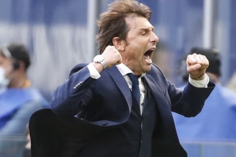 Inter Milan's head coach Antonio Conte celebrates his side's 1-0 win at the end of the Serie A soccer match between Inter Milan and Hellas Verona, at the San Siro stadium in Milan, Italy, Sunday, April 25, 2021. (AP Photo/Antonio Calanni)