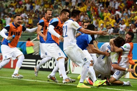 FORTALEZA, BRAZIL - JUNE 24:  Giorgos Samaras of Greece celebrates with teammates after scoring his team's second goal on a penalty kick during the 2014 FIFA World Cup Brazil Group C match between Greece and the Ivory Coast at Castelao on June 24, 2014 in Fortaleza, Brazil.  (Photo by Laurence Griffiths/Getty Images)