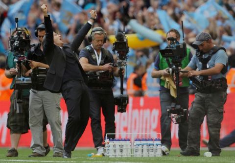 Manchester City's manager  Roberto Mancini (3rd L) celebrates after his side beat Stoke 1-0 during the FA Cup final football match between Manchester City and Stoke City at Wembley Stadium in London, on May 14, 2011. AFP PHOTO / ADRIAN DENNIS
NOT FOR MARKETING OR ADVERTISING USE/RESTRICTED TO EDITORIAL USE (Photo credit should read ADRIAN DENNIS/AFP/Getty Images)