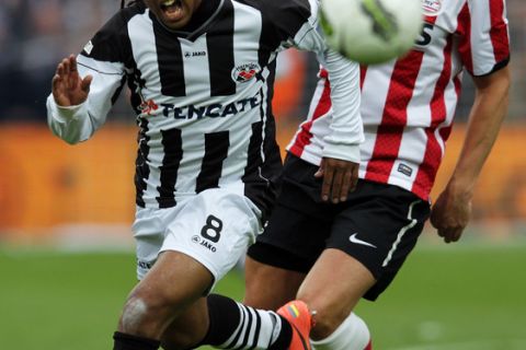 ROTTERDAM, NETHERLANDS - APRIL 08:  Erik Pieters of PSV and Lerin Duarte of Heracles battle for the ball during the Dutch Cup Final between PSV Eindhoven and SC Heracles Almelo at Feijenoord Stadion on April 8, 2012 in Rotterdam, Netherlands.  (Photo by Dean Mouhtaropoulos/Getty Images)