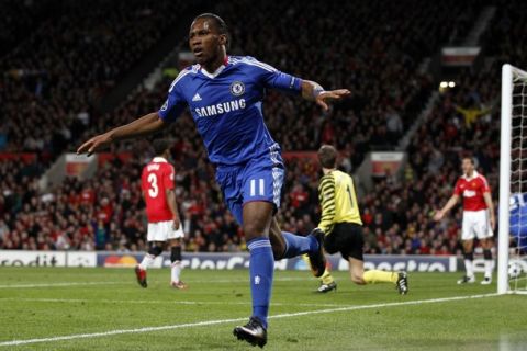 Chelsea's Didier Drogba celebrates after scoring during their Champions League quarter-final second leg soccer match against Manchester United at Old Trafford in Manchester, northern England April 12, 2011.   REUTERS/Darren Staples  (BRITAIN - Tags: SPORT SOCCER)