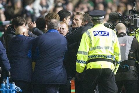 Rangers' assistant manager Ally McCoist and Celtic's Neil Lennon square up at the end of the match