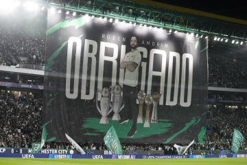 Sporting fans display a banner showing the head coach Ruben Amorim with "thank you" written on it during the UEFA Champions League opening phase match between Sporting and Manchester City in Lisbon, Portugal, Tuesday, Nov. 5, 2024. (AP Photo/Armando Franca)