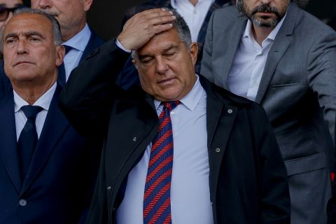 FC Barcelona club President Joan Laporta, center, gestures at the stand before a Spanish La Liga soccer match between Barcelona and Rayo Vallecano at the Olimpic Lluis Companys stadium in Barcelona, Spain, Sunday, May 19, 2024. (AP Photo/Joan Monfort)