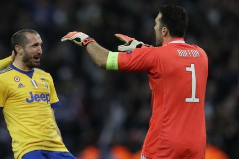 From left, Juventus' Andrea Barzagli, Giorgio Chiellini and Gianluigi Buffon celebrate their side's 2-1 win, at the end of the the Champions League, round of 16, second-leg soccer match between Juventus and Tottenham Hotspur, at the Wembley Stadium in London, Wednesday, March 7, 2018. (AP Photo/Kirsty Wigglesworth)