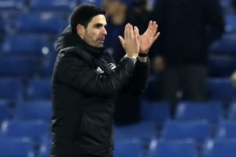 Arsenal's head coach Mikel Arteta applauds to supporters at the end of the English Premier League soccer match between Chelsea and Arsenal at Stamford Bridge Stadium in London, Tuesday, Jan. 21, 2020. (AP Photo/Matt Dunham)