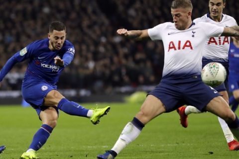 Chelsea's Eden Hazard, left, kicks the ball past Tottenham's Kieran Trippier during the English League Cup semifinal first leg soccer match between Tottenham Hotspur and Chelsea at Wembley Stadium in London, Tuesday, Jan. 8, 2019. (AP Photo/Kirsty Wigglesworth)