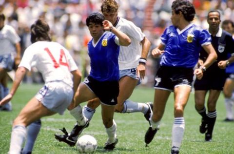 Diego Maradona of Argentina (centre) in full flight