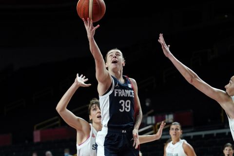 France's Alix Duchet (39) drives to the basket ahead of Serbia's Sonja Vasic (5) during the women's basketball bronze medal game at the 2020 Summer Olympics, Saturday, Aug. 7, 2021, in Saitama, Japan. (AP Photo/Charlie Neibergall)