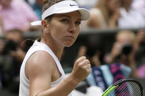 Romania's Simona Halep reacts after scoring a point against United States' Serena Williams during the women's singles final match on day twelve of the Wimbledon Tennis Championships in London, Saturday, July 13, 2019. (AP Photo/Tim Ireland)