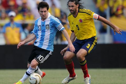 Argentina's Lionel Messi (L) attempts to dribble past Colombia's Mario Yepes during the Brazil 2014 FIFA World Cup South American qualifier match at the Metropolitano stadium in Barranquilla, on November 15, 2011. AFP PHOTO / EITAN ABRAMOVICH (Photo credit should read EITAN ABRAMOVICH/AFP/Getty Images)