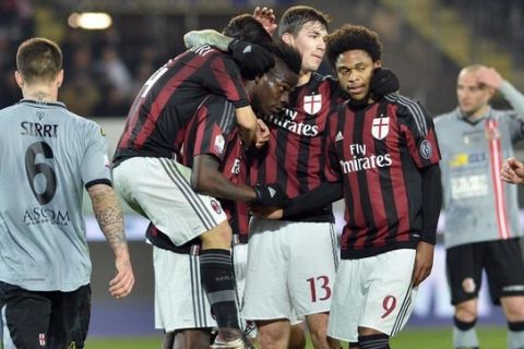 Milan's forward Mario Balotelli (C) celebrates with his teammates after scoring the goal (0-1) during the Italy Cup first leg semifinal soccer match Us Alessandria vs Ac Milan at Olimpico stadium in Turin, Jan. 26, 2016. ANSA / ANDREA DI MARCO