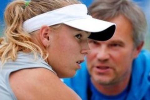 FILE -- This is an Oct. 17, 2009, file photo showing Caroline Wozniacki of Denmark, left, talking with her father and coach, Victor Krason, during her semi-final match against Samantha Stosur of Australia at the Japan Women's Open Tennis in Osaka,western Japan. Tennis authorities are looking into a WTA Tour match involving U.S. Open finalist Caroline Wozniacki that apparently sparked bettors to pile money on her opponent when she was on the verge of losing in straight sets.  (AP Photo/Itsuo Inouye, File)