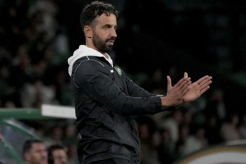 Sporting's head coach Ruben Amorim, who Manchester United has expressed an interest in hiring, claps his hands during a Portuguese League Cup soccer match between Sporting CP and Nacional at the Alvalade stadium in Lisbon, Tuesday, Oct. 29, 2024. (AP Photo/Ana Brigida)