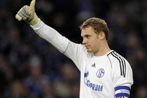 Schalke captain goalkeeper Manuel Neuer shows thumbs up after the German first division Bundesliga soccer match between FC Schalke 04 and FC St. Pauli in Gelsenkirchen , Germany, Friday, Nov. 5, 2010. Schalke defeated Pauli with 3-0, Raul scored 2 goals. (AP Photo/Martin Meissner) ** NO MOBILE USE UNTIL 2 HOURS AFTER THE MATCH, WEBSITE USERS ARE OBLIGED TO COMPLY WITH DFL-RESTRICTIONS, SEE INSTRUCTIONS FOR DETAILS **