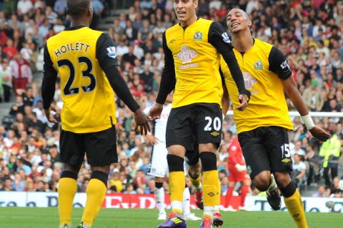 Blackburn Rovers' Ruben Rochina (C) celebrates after scoring a goal against Fulham during their Premiership match at Craven Cottage in London, England on September 11, 2011. AFP PHOTO/BEN STANSALL

RESTRICTED TO EDITORIAL USE. No use with unauthorized audio, video, data, fixture lists, club/league logos or live services. Online in-match use limited to 45 images, no video emulation. No use in betting, games or single club/league/player publications. (Photo credit should read BEN STANSALL/AFP/Getty Images)