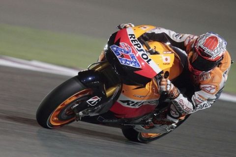 Honda MotoGP rider Casey Stoner of Australia takes a corner during the free practice at the Losail international circuit in Doha March 17, 2011. REUTERS/Mohammed Dabbous (QATAR - Tags: SPORT MOTOR RACING)