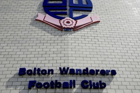 FILE - This Aug. 11, 2018 file photo shows a general view of Bolton Wanderers football stadium in Bolton, England. The days of Youri Djorkaeff, Jay-Jay Okocha and Fernando Hierro running out to play Premier League games for Bolton Wanderers must seem like a lifetime ago for long-suffering fans of the English soccer team. Bolton officials are due in the High Court in central London Wednesday, April 3, 2019 over an unpaid tax bill of 1.2 million pounds ($1.6 million) and other debts. Its players are on strike over unpaid wages and the team is on the verge of relegation to the third tier. (Clint Hughes/PA via AP, file)