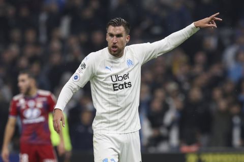 Marseille's Kevin Strootman gestures during the French League One soccer match between Marseille and Lyon at the Velodrome stadium in Marseille, southern France, Sunday, Nov. 10, 2019. (AP Photo/Daniel Cole)