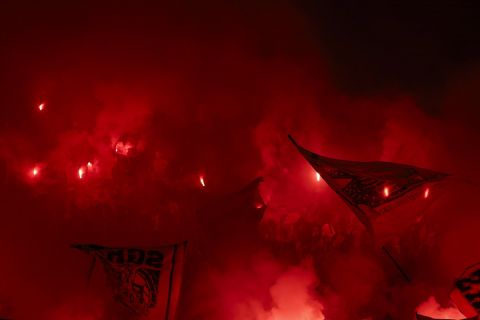 Dortmund supporters lit flares during the Champions League final soccer match between Borussia Dortmund and Real Madrid at Wembley stadium in London, Saturday, June 1, 2024. (AP Photo/Ian Walton)