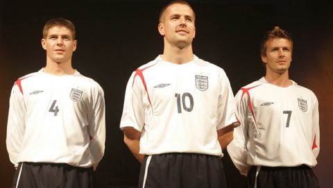 Before their World Cup qualifier soccer match against Northern Ireland on the 26th of March England footballers David Beckham, right, Michael Owen, centre, and Steven Gerrard help to launch a new home kit by sponsors Umbro at the Lowry Hotel in Manchester, England, Wednesday March 23, 2005. (AP Photo/Jon Super).