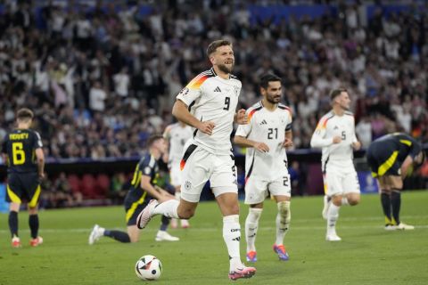 Germany's Niclas Fuellkrug celebrates after scoring his side's fourth goal during a Group A match between Germany and Scotland at the Euro 2024 soccer tournament in Munich, Germany, Friday, June 14, 2024. (AP Photo/Antonio Calanni)