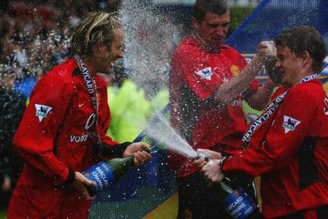 LIVERPOOL - MAY 11:  Manchester United players David Beckham, Roy Keane and Ole Gunnar Solskjaer spray champagne at each other after the FA Barclaycard Premiership match between Everton and Manchester United held on May 11, 2003 at Goodison Park, in Liverpool, England. Manchester United won the match 2-1. (Photo by Gary M. Prior/Getty Images)