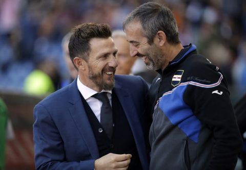 Sampdoria coach Marco Giampaolo, right, and Roma coach Eusebio Di Francesco share a smile prior to a Serie A soccer match between Roma and Sampdoria, at the Rome Olympic stadium, Sunday, Nov. 11, 2018. (AP Photo/Alessandra Tarantino)