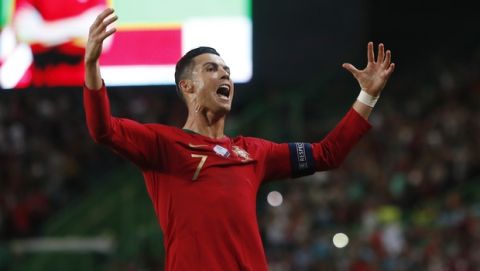 Portugal's Cristiano Ronaldo celebrates after scoring his side's second goal during the Euro 2020 group B qualifying soccer match between Portugal and Luxembourg at the Jose Alvalade stadium in Lisbon, Friday, Oct 11, 2019. (AP Photo/Armando Franca)