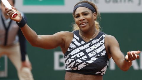 Serena Williams of the U.S. reacts after missing a shot against Vitalia Diatchenko of Russia during their first round match of the French Open tennis tournament at the Roland Garros stadium in Paris, Monday, May 27, 2019. (AP Photo/Pavel Golovkin)