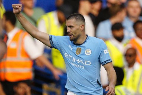 Manchester City's Mateo Kovacic celebrates after scoring his side's second goal during the English Premier League soccer match between Chelsea and Manchester City at Stamford Bridge stadium in London, England, Sunday, Aug, 18, 2024. (AP Photo/Dave Shopland)