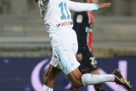 Marseille's French forward Loic Remy reacts after scoring against Paris Saint Germain during their League One soccer match at the Velodrome Stadium, Marseille, southern France, Sunday, Nov. 27, 2011. (AP Photo/Claude Paris)