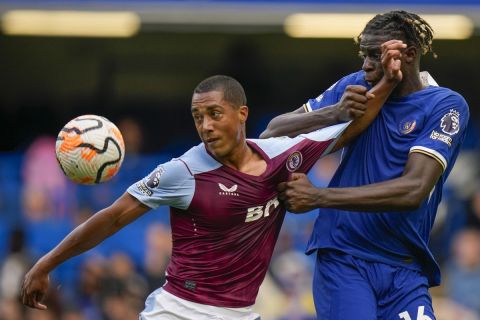 Aston Villa's Youri Tielemans, left, jumps for the ball with Chelsea's Lesley Ugochukwu during the English Premier League soccer match between Chelsea and Aston Villa at Stamford Bridge stadium in London, Sunday, Sept. 24, 2023. (AP Photo/Alastair Grant)