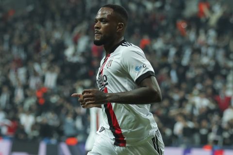 Besiktas' Cyle Larin celebrates after scoring his side's first goal during Champions League group C soccer match between Besiktas and Sporting Lisbon at the Vodafone Park Stadium in Istanbul, Turkey, Tuesday, Oct. 19, 2021. (AP Photo)