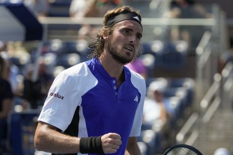 Stefanos Tsitsipas, of Greece, reacts after scoring a point against Thanasi Kokkinakis, of Australia,during the first round of the U.S. Open tennis championships, Tuesday, Aug. 27, 2024, in New York. (AP Photo/Pamela Smith)