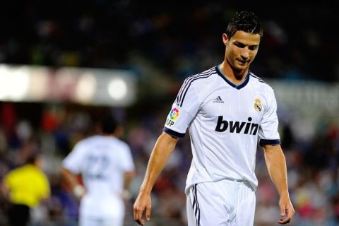 GETAFE, SPAIN - AUGUST 26: Cristiano Ronaldo of Real Madrid recats defeated during the la Liga match between Getafe and Real Madrid at Coliseum Alfonso Perez on August 26, 2012 in Getafe, Spain.  (Photo by Gonzalo Arroyo Moreno/Getty Images)