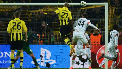 Dortmund's Brazilian defender Felipe Santana (C) heads the ball to score the 1-0 during the UEFA Champions League last 16, second leg match Borussia Dortmund vs Shakhtar Donetsk in Dortmund, western Germany, on March 5, 2013.     AFP PHOTO / PATRIK STOLLARZ        (Photo credit should read PATRIK STOLLARZ/AFP/Getty Images)